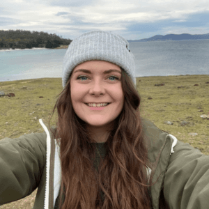 A selfie of Paige Bwye against the backdrop of a lake